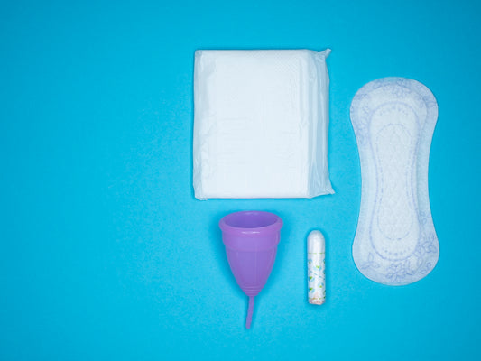 a blue table with a toothbrush, a tube of toothpaste and a