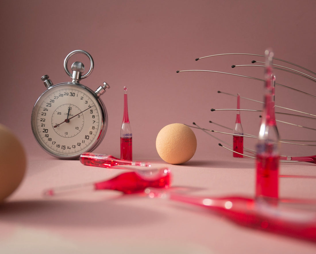 red and silver analog alarm clock