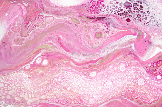 a pink and white painting with lots of bubbles