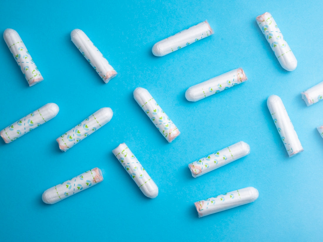 a group of pills sitting on top of a blue surface