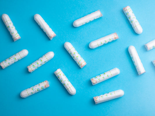 a group of pills sitting on top of a blue surface
