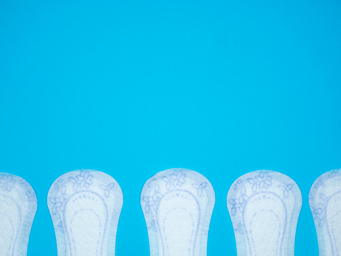 a row of white vases sitting next to each other