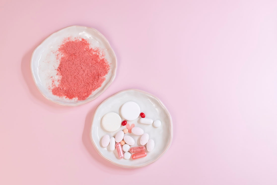 Two bowls of red and white powder on a pink background